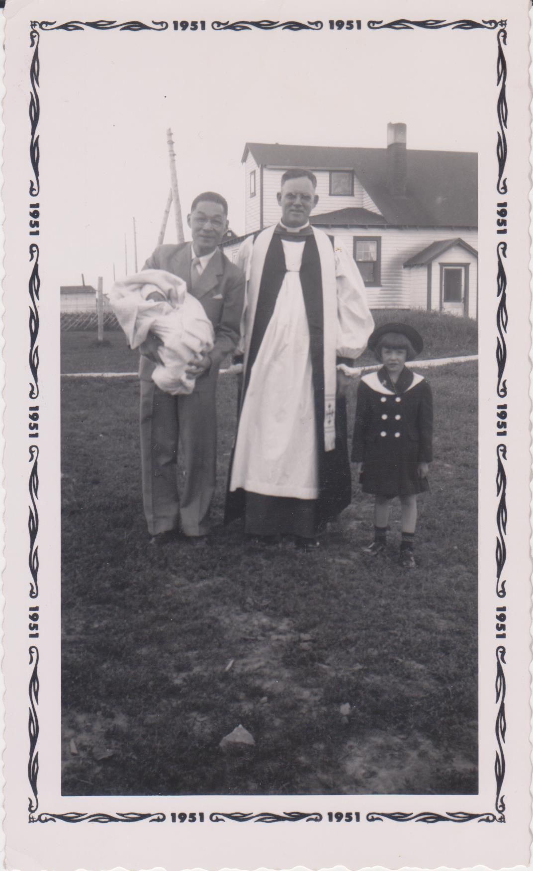 Dr. Chiang holding his godson in Whitehorse, NWT sometime in 1951