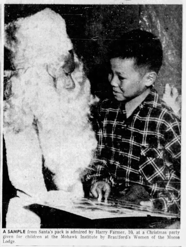 Santa and a Kid, Harry Farmer, from Mohawk Institute Posed for a Picture